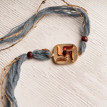 Load image into Gallery viewer, Handpainted Swastika Rakhi with Chandan Beads