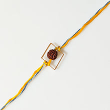 Load image into Gallery viewer, Rudraksha Rakhi with yellow and blue thread with gold square frame