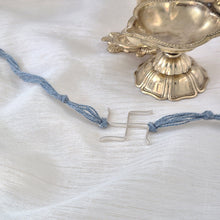 Load image into Gallery viewer, Silver Swastik Rakhi with blue thread