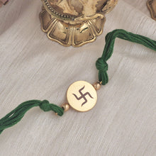 Load image into Gallery viewer, Gold Plated Swastik Rakhi with emerald green thread