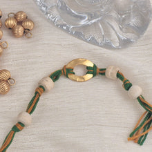 Load image into Gallery viewer, Gold plated pendant Rakhi with tulsi beads
