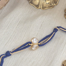 Load image into Gallery viewer, Gold Plated Crystal Rakhi with blue and brown thread