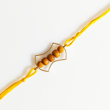 Load image into Gallery viewer, Gold Frame Rakhi with yellow Thread and beads