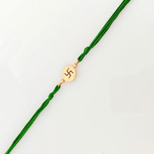 Load image into Gallery viewer, Gold Plated Swastik Rakhi with emerald green thread