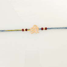 Load image into Gallery viewer, Handmade Shri Rakhi with blue and yellow thread with chandan beads