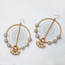 Load image into Gallery viewer, GOLD TONED CIRCULAR DROP EARRINGS WITH CREST &amp; ENAMEL CHARMS DETAIL
