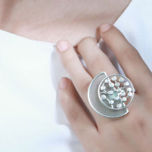 Load image into Gallery viewer, SILVER TONED CYAN ACRYLIC ARC RING WITH OVERLAID DOTTED CIRCLE