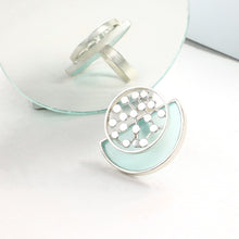 Load image into Gallery viewer, SILVER TONED CYAN ACRYLIC ARC RING WITH OVERLAID DOTTED CIRCLE