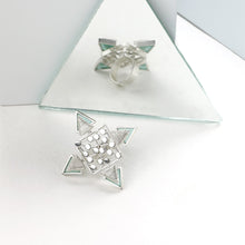 Load image into Gallery viewer, SILVER TONED DOTTED RHOMBUS RING WITH COILED CYAN ACRYLIC TRIANGLES WORN BY MALAVIKA NAIR
