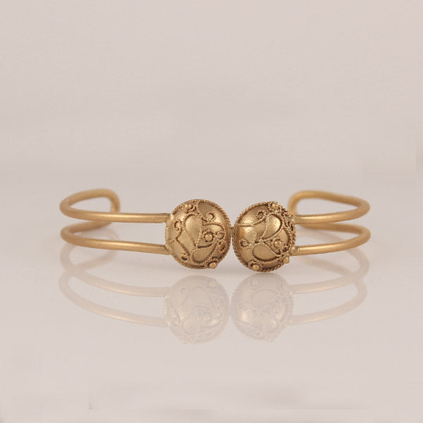 Abani gold plated wire hand cuff