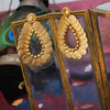 Gold coin motif and Surya earrings