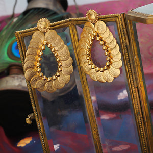 Gold coin motif and Surya earrings