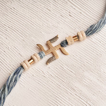 Load image into Gallery viewer, Swastika Rakhi with Scroll &amp; Tulsi Beads on Denim Thread
