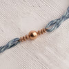 Metal Ball Rakhi with Denim Thread & Tulsi Beads