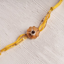 Load image into Gallery viewer, Flower Rakhi with a Tulsi &amp; Spiritual Chandan Bead center
