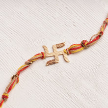 Load image into Gallery viewer, Swastika Rakhi with Multicolor Thread &amp; Gold Links
