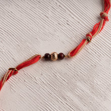 Load image into Gallery viewer, Rakhi with Spiritual Chandan Beads with Red &amp; Jute Tie Up Thread
