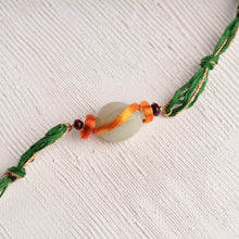 Load image into Gallery viewer, Green Chalcedony Gold-plated Om Rakhi with Glitter thread for that March Sibling
