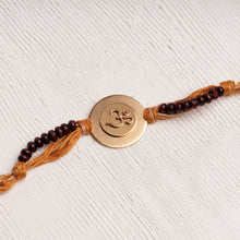 Load image into Gallery viewer, Om Rakhi Charm with Chandan Beads &amp; Mustard Thread
