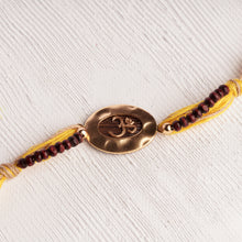 Load image into Gallery viewer, Om Rakhi Charm with Spiritual Chandan Beads
