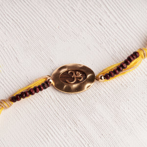 Om Rakhi Charm with Spiritual Chandan Beads