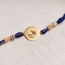 Load image into Gallery viewer, Om Rakhi Charm with Tulsi Beads on Blue thread
