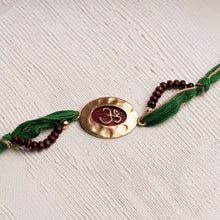 Load image into Gallery viewer, Om Rakhi Charm &amp; Spiritual Chandan Beads on Green Thread
