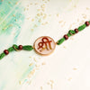 Shree Rakhi Handpainted on an Acryclic Disc