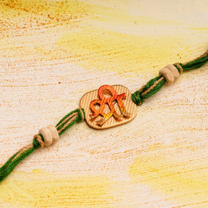 Square Shree Rakhi with Tulsi beads & Green thread