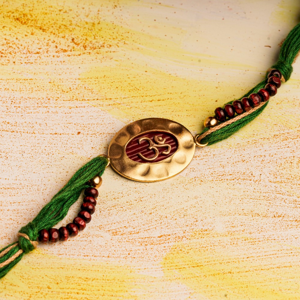 Om Rakhi Charm & Spiritual Chandan Beads on Green Thread