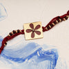 Square Flower Rakhi in Maroon with Chandan & Tulsi Beads