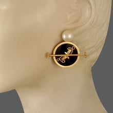 Load image into Gallery viewer, GOLD PLATED BLACK AC ROUND EARRING WITH HALF PEARL, WILDERNESS AND STUD ON IT
