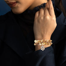 Load image into Gallery viewer, Gold coin cluster cuff with crystal flower charm
