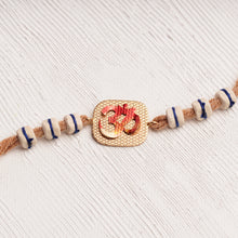 Load image into Gallery viewer, Handpainted Om Rakhi with Tulsi Beads &amp; brown thread
