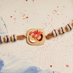 Handpainted Om Rakhi with Tulsi Beads & brown thread