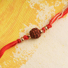 Load image into Gallery viewer, Rudraksha Rakhi with Gold Beads &amp; Red thread
