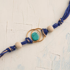 Turquoise Stone Rakhi with Tulsi Beads and Blue Thread