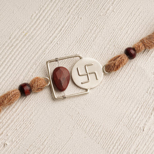 92.5 Silver Plated Swastik Rakhi with a Red Stone