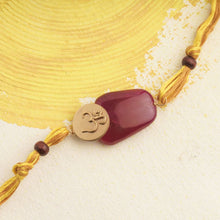 Load image into Gallery viewer, RED CHALCEDONY Om Rakhi with Chandan Beads
