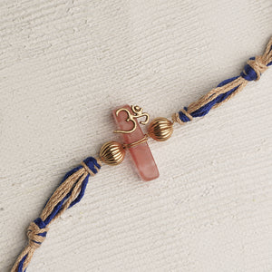 Pink Stone Gold Plated Om Rakhi with blue thread