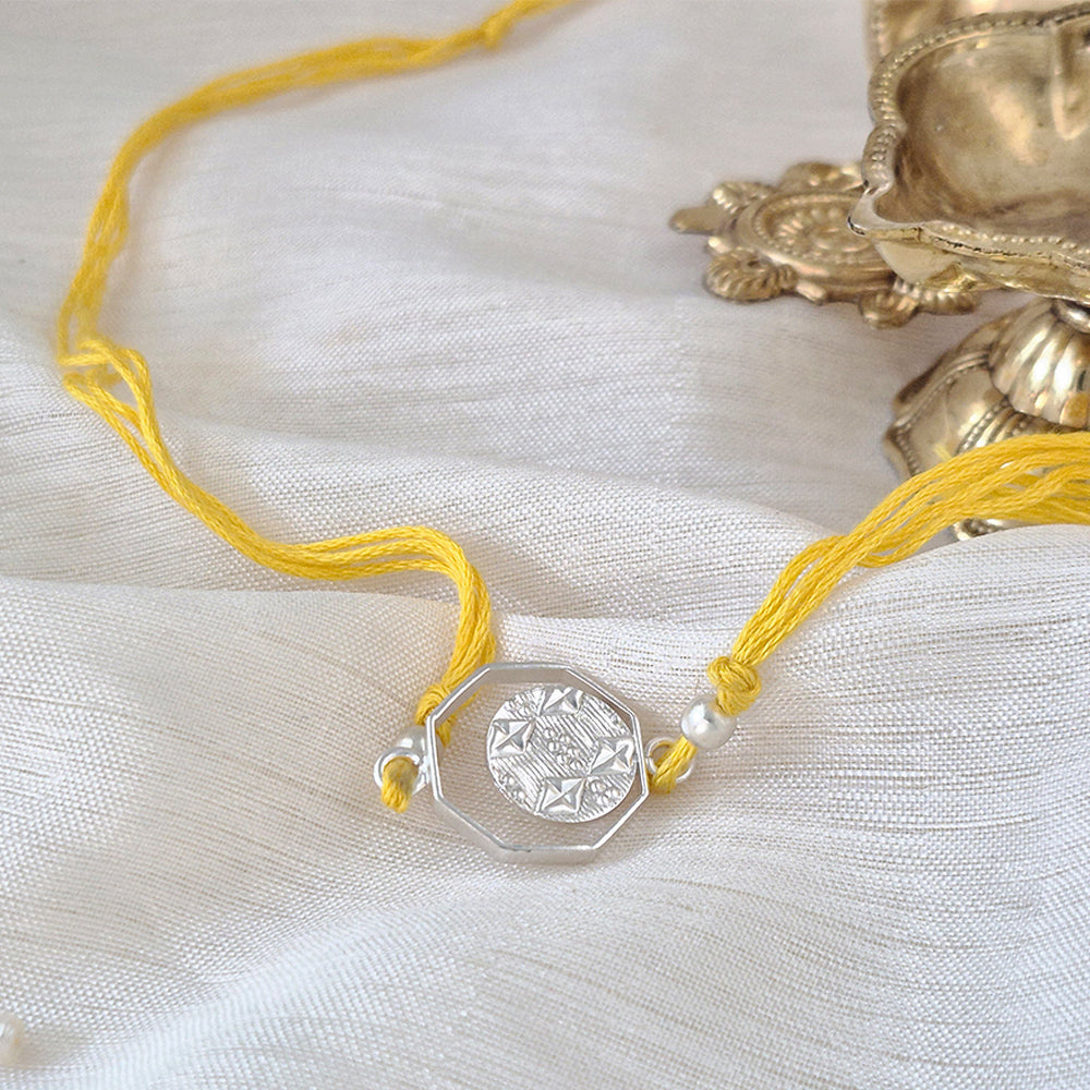 Silver plated Rakhi with yellow Thread – Suhani Pittie