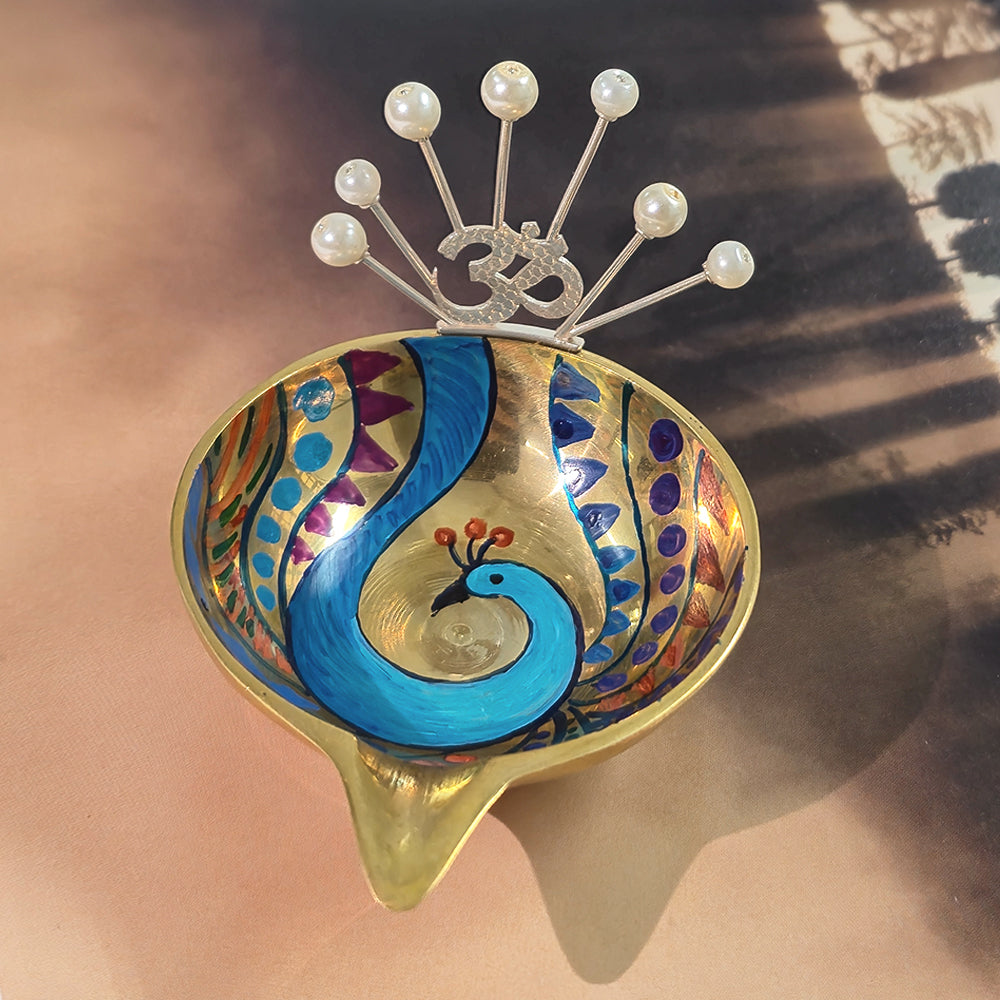 Hand painted peacock diya decor with om