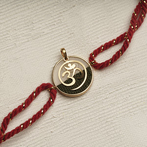22K Gold Om Rakhi with Red & Gold thread changeable into a pendant