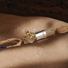 Load image into Gallery viewer, 22K Gold Om Rakhi on Acryclic Tube with Tie Up thread
