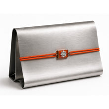 Load image into Gallery viewer, Neon Orange Rakhi with Silver Motif and round cord
