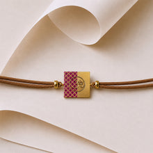 Load image into Gallery viewer, Handcrafted and painted 22K gold plated Cord Rakhi for Brother

