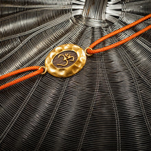 Load image into Gallery viewer, Gold Om Rakhi with Orange Cord
