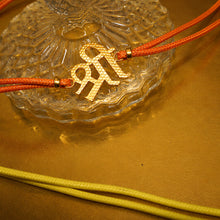 Load image into Gallery viewer, Gold Shri Rakhi with Orange Cord for Brother
