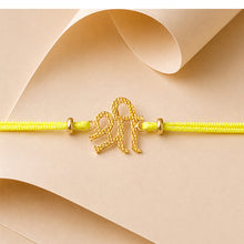 Load image into Gallery viewer, Gold Shri Rakhi with Yellow Cord
