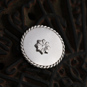 92.5 Sterling Silver Coin with entwined border and delicate flower detailing